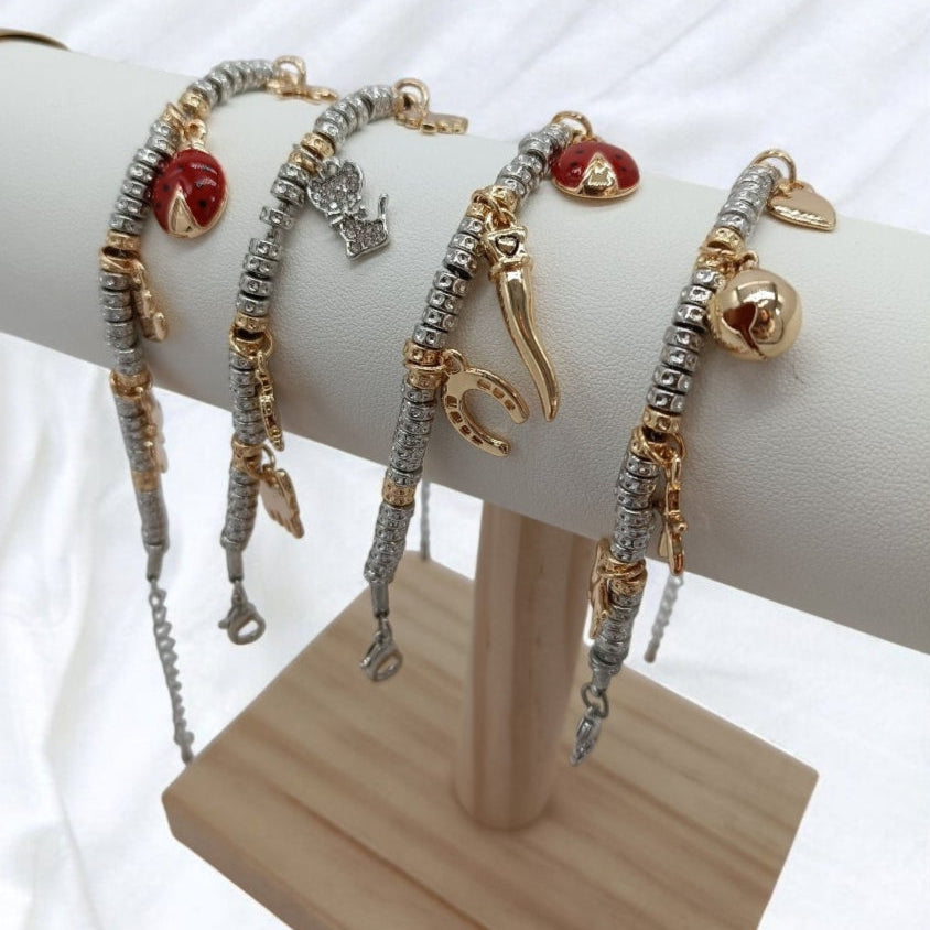 Bracciali granelli argento e oro giallo con charms