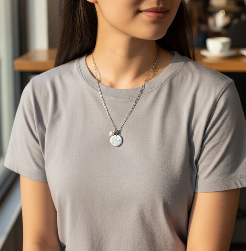 Collana medaglia e pendente perla