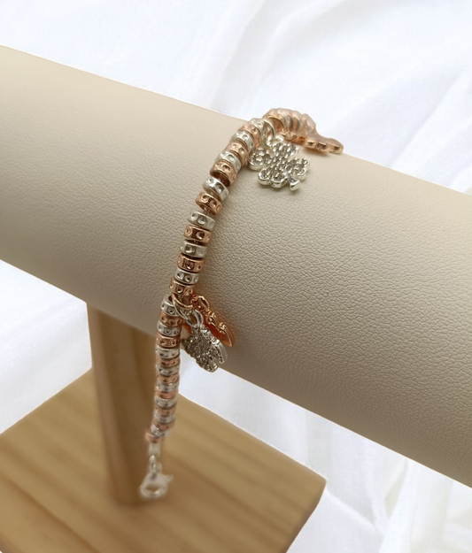 Bracciale granelli martellati argento e oro rosa