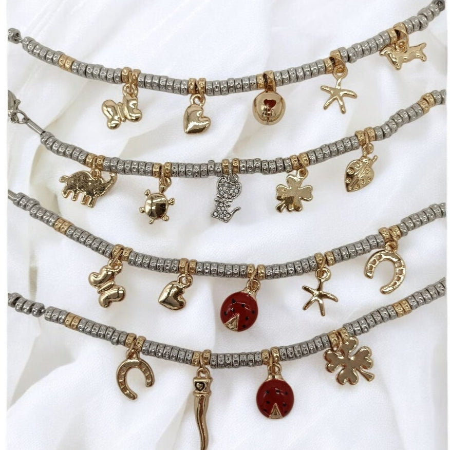 Bracciali granelli argento e oro giallo con charms