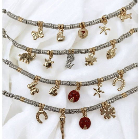 Bracciali granelli argento e oro giallo con charms