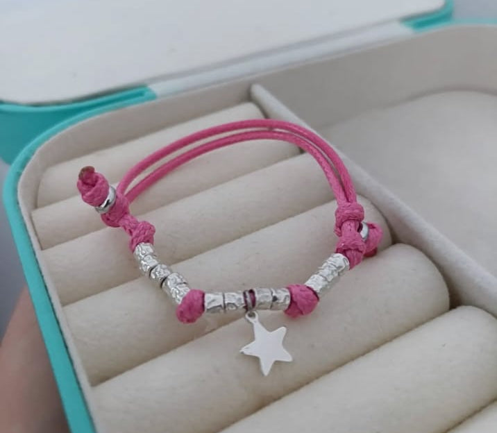 Bracciale cordino baby con stella e 10 granelli