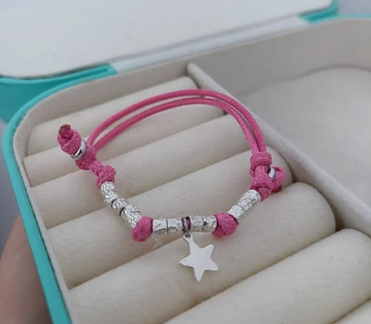 Bracciale cordino baby con stella e 10 granelli