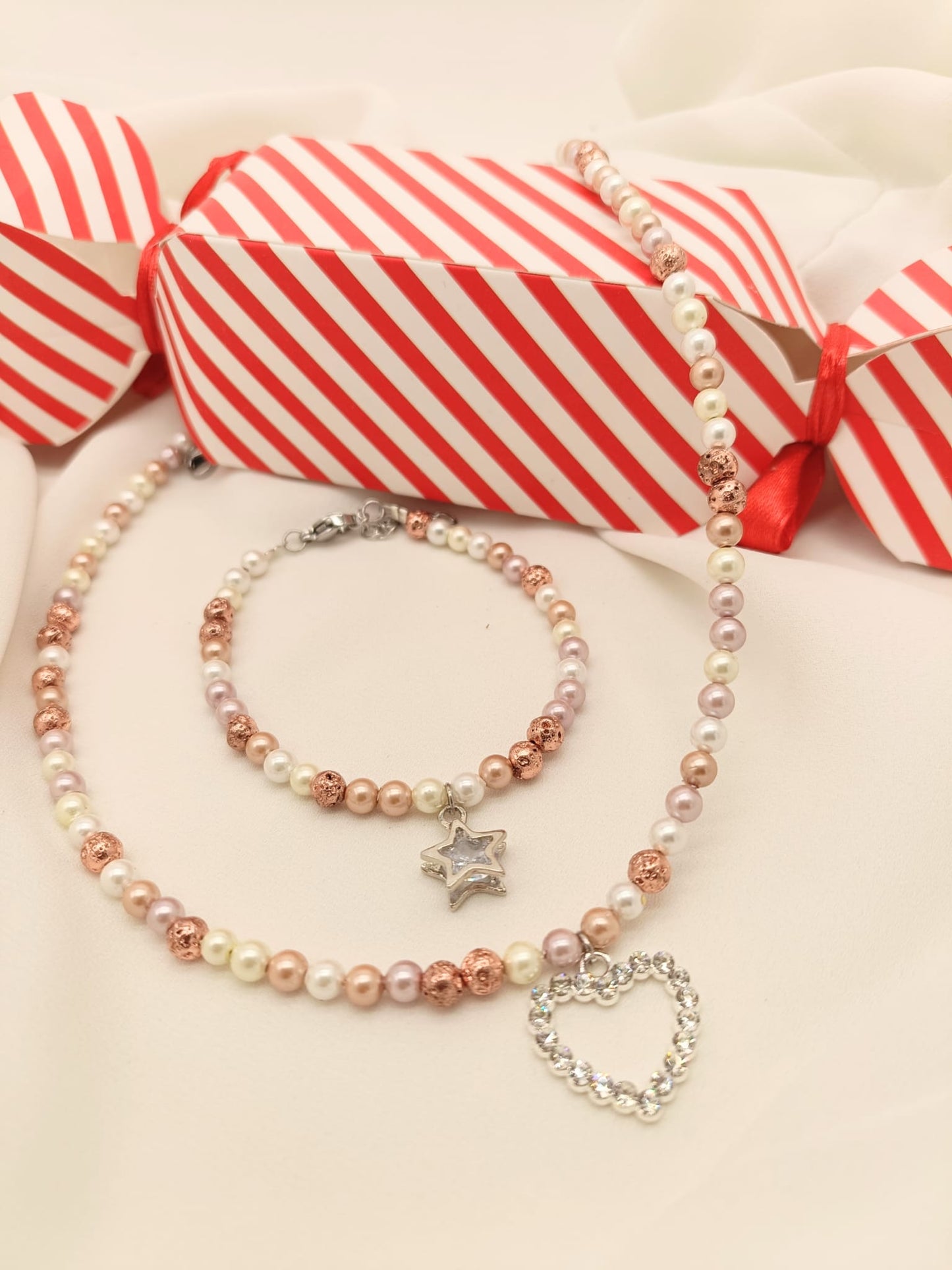 Bracciale perle di fiume chiare/rosate e stella