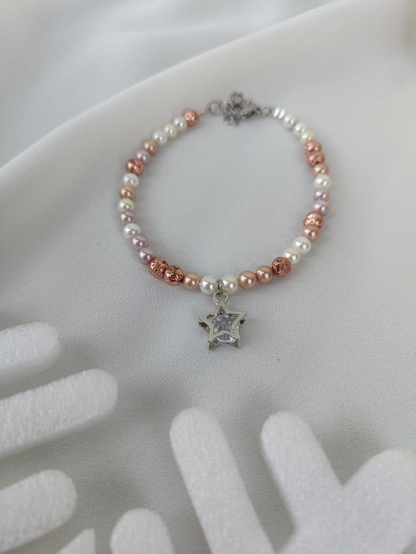 Bracciale perle di fiume chiare/rosate e stella