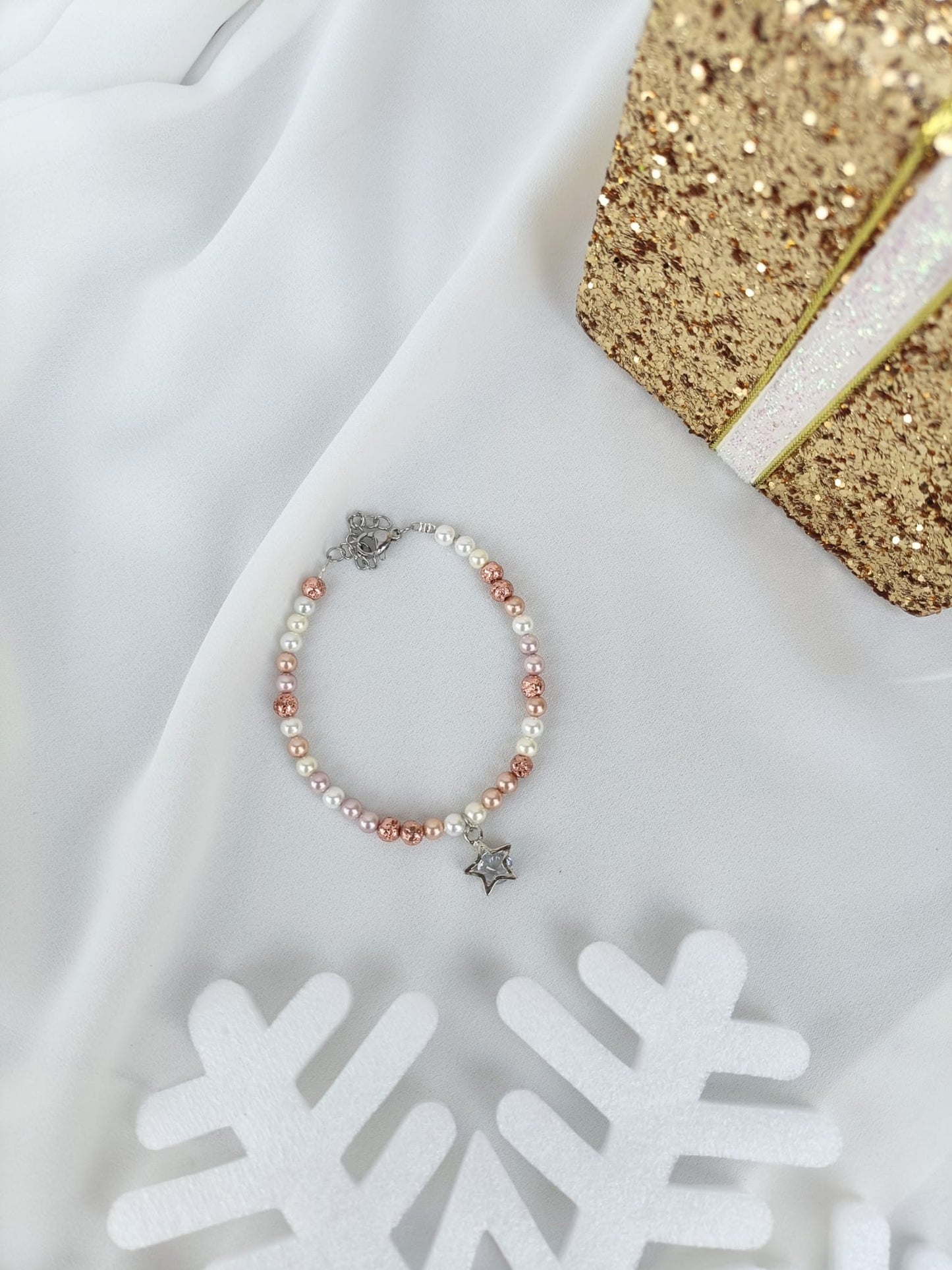 Bracciale perle di fiume chiare/rosate e stella