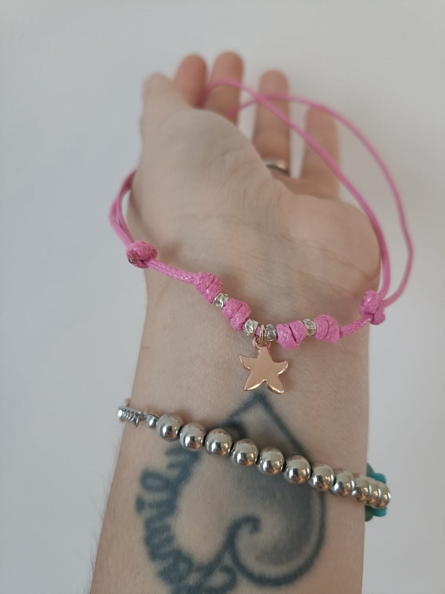Collana cordino colorato con 4 granelli e stella