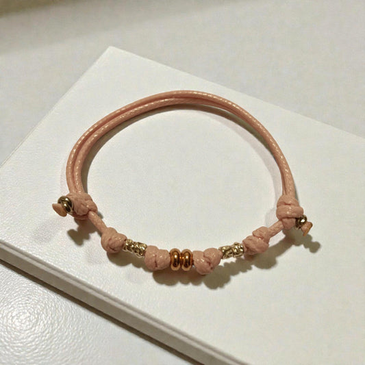 Bracciale cordino, granelli e rondelle argento 925