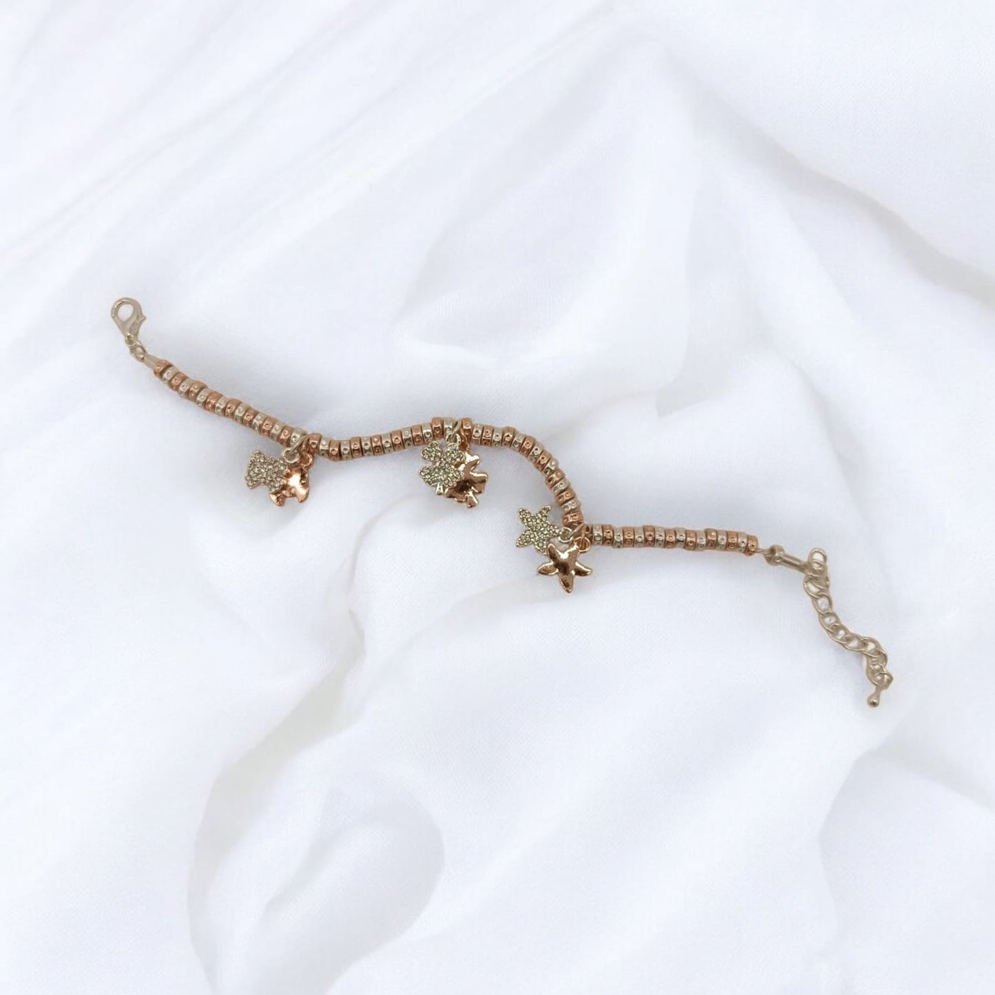 Bracciale granelli martellati argento e oro rosa