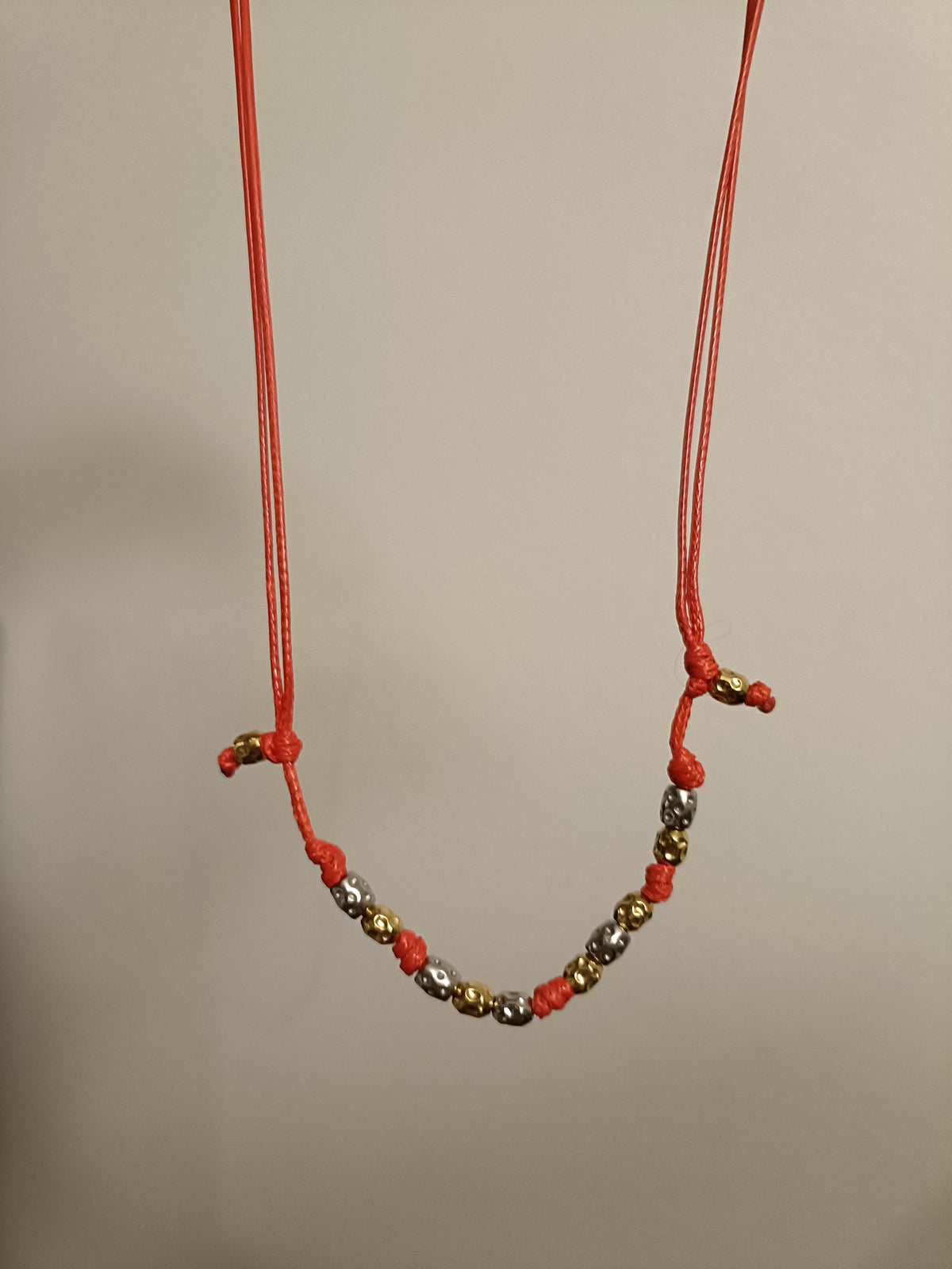 Collana 10 granelli martellati argento oro